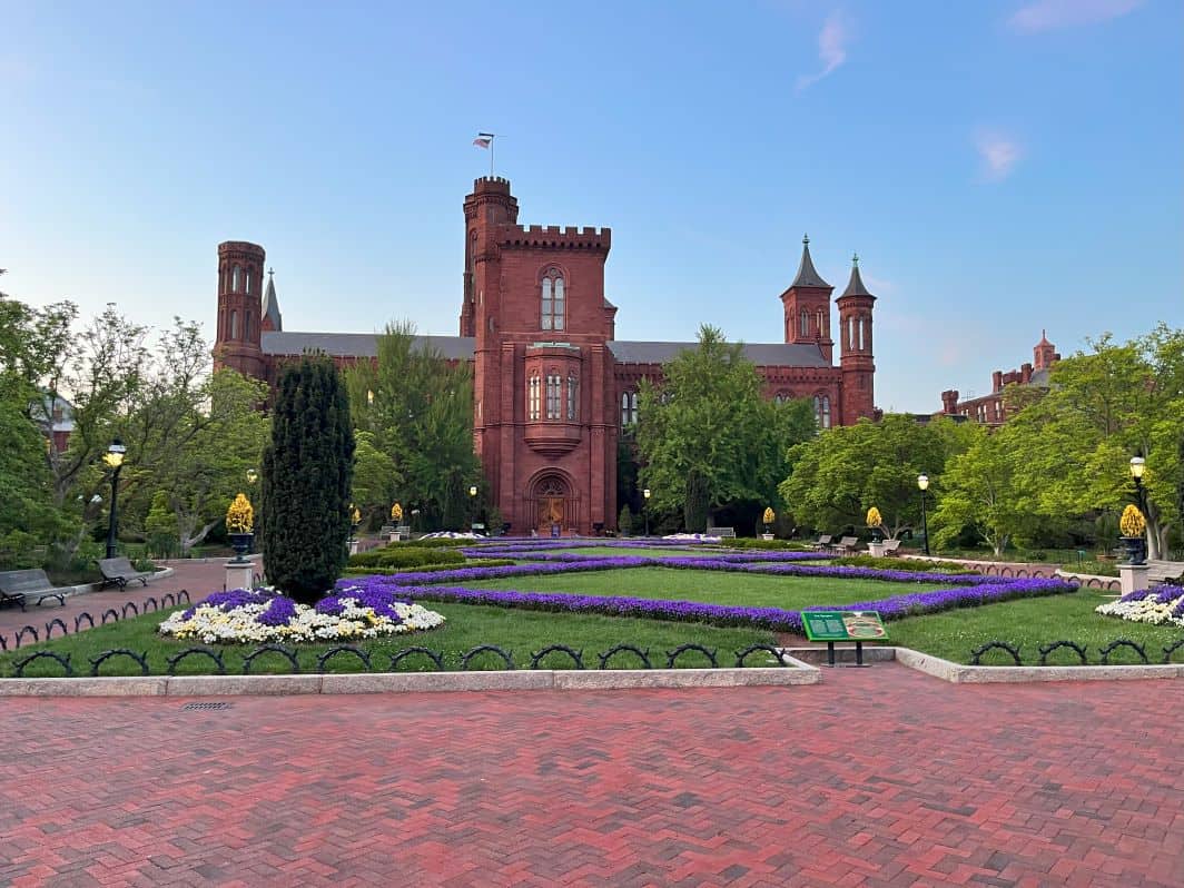 The Smithsonian Institution Castle and a glimpse of the gardens. 