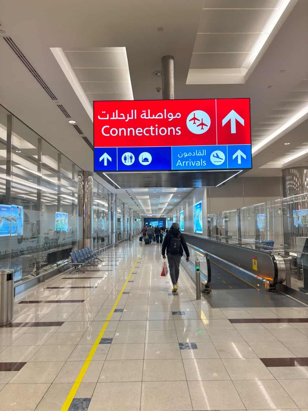 Follow signs for connecting flights if you are connecting in Dubai, or follow to Arrivals if you are staying in Dubai. 