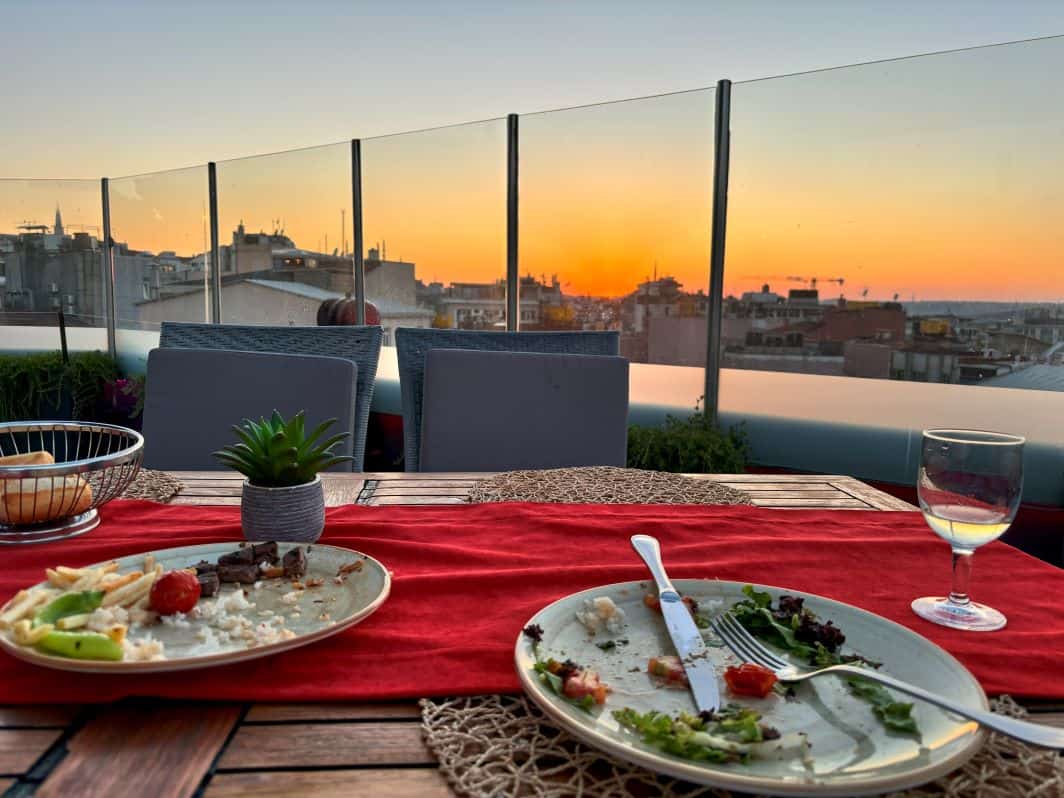 Enjoying the sunset with delicious food and beverages at the rooftop restaurant at the Hilton. 