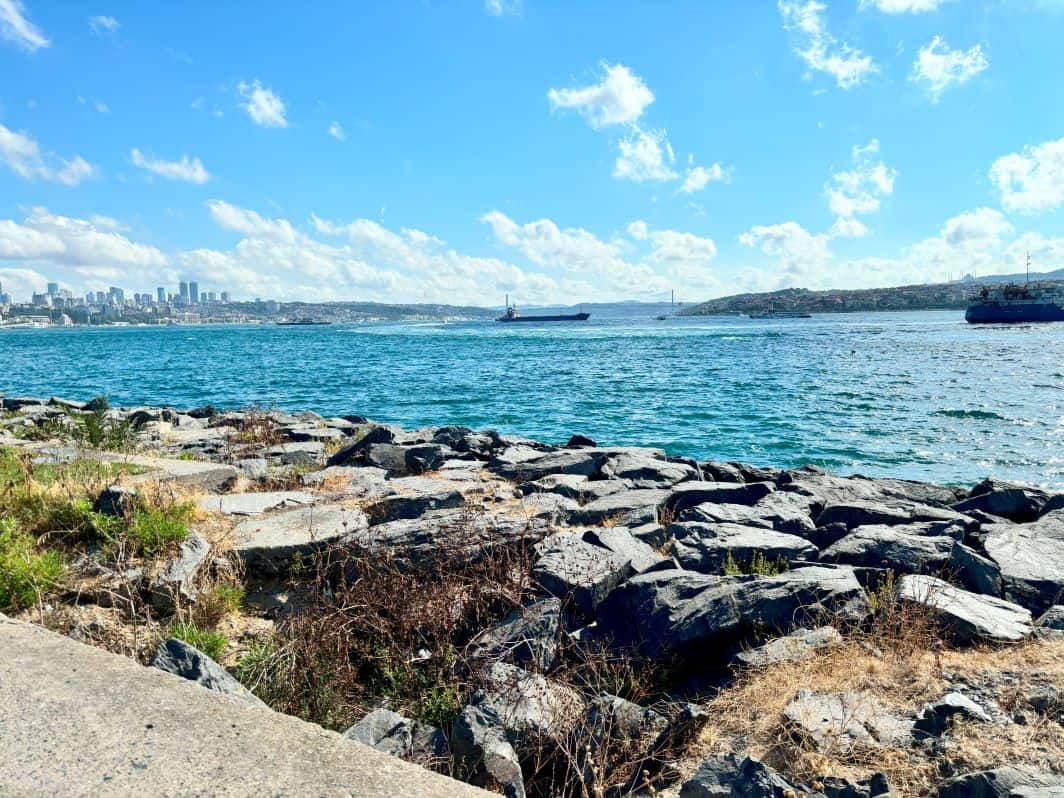Walking on the walkway at Sarayburnu Park while looking across at the bridge that connects Europe with Asia. 