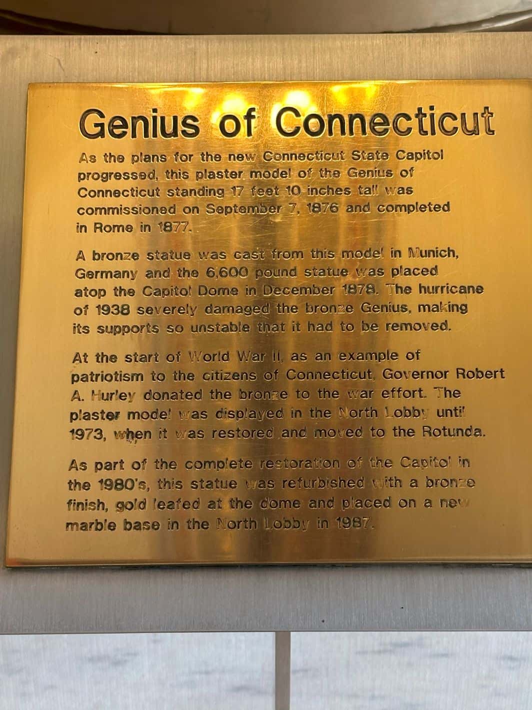 The plaque detailing the story around the Genius of Connecticut
