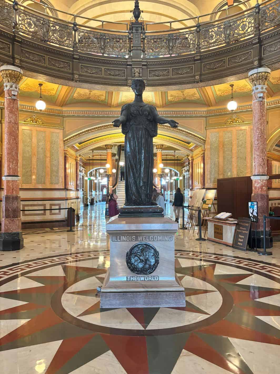 Illinois Welcoming the World Statue in the center rotunda. 