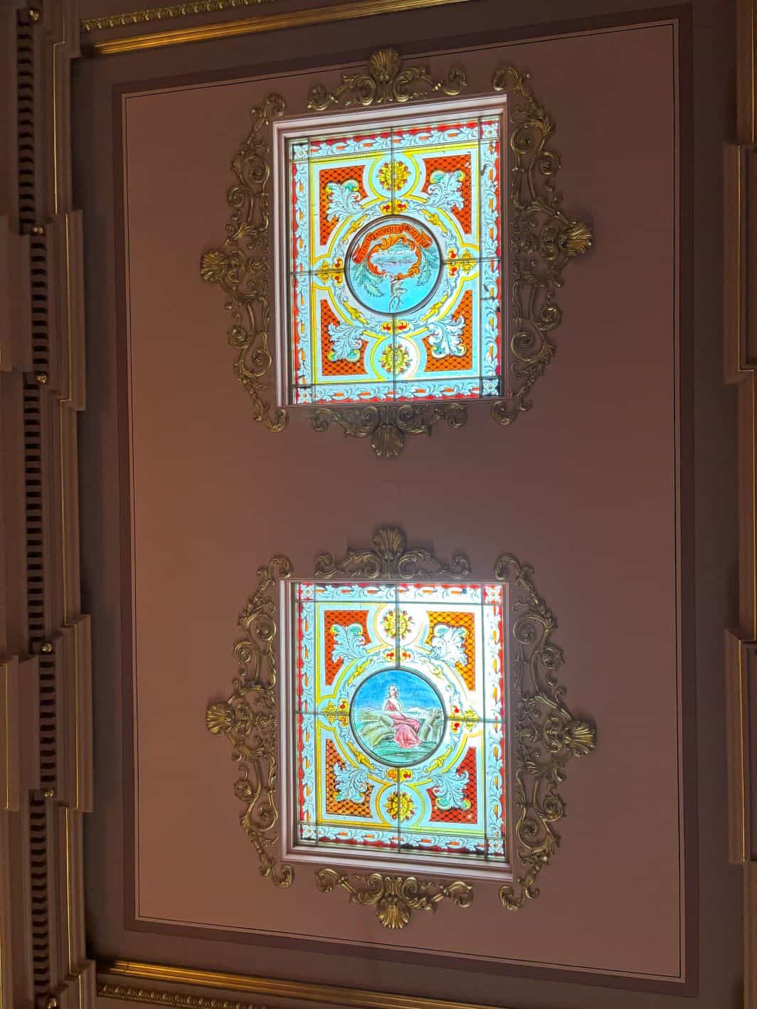 The framed stained glass overhead. 