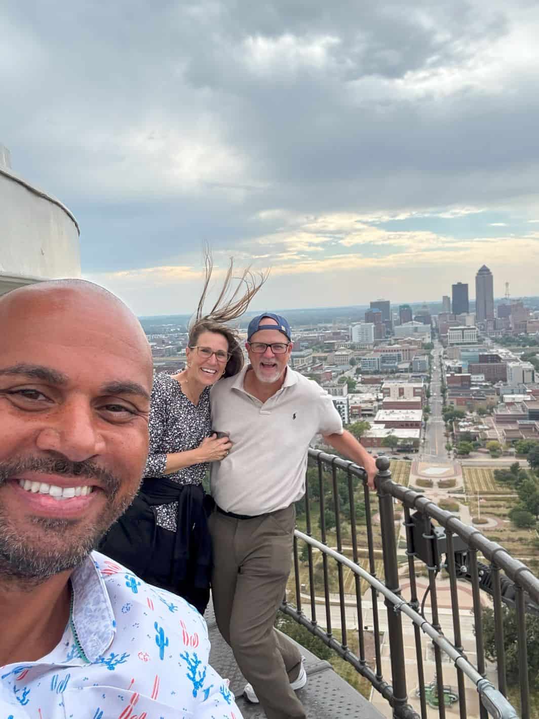 Izaah Knox, Iowa State Senator, is taking our pictures at the top of the Capitol 