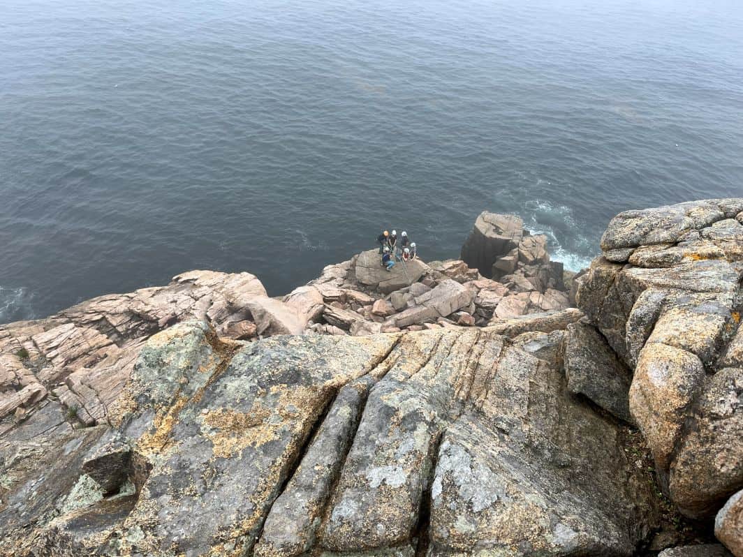 Rock climbers on the ledge below